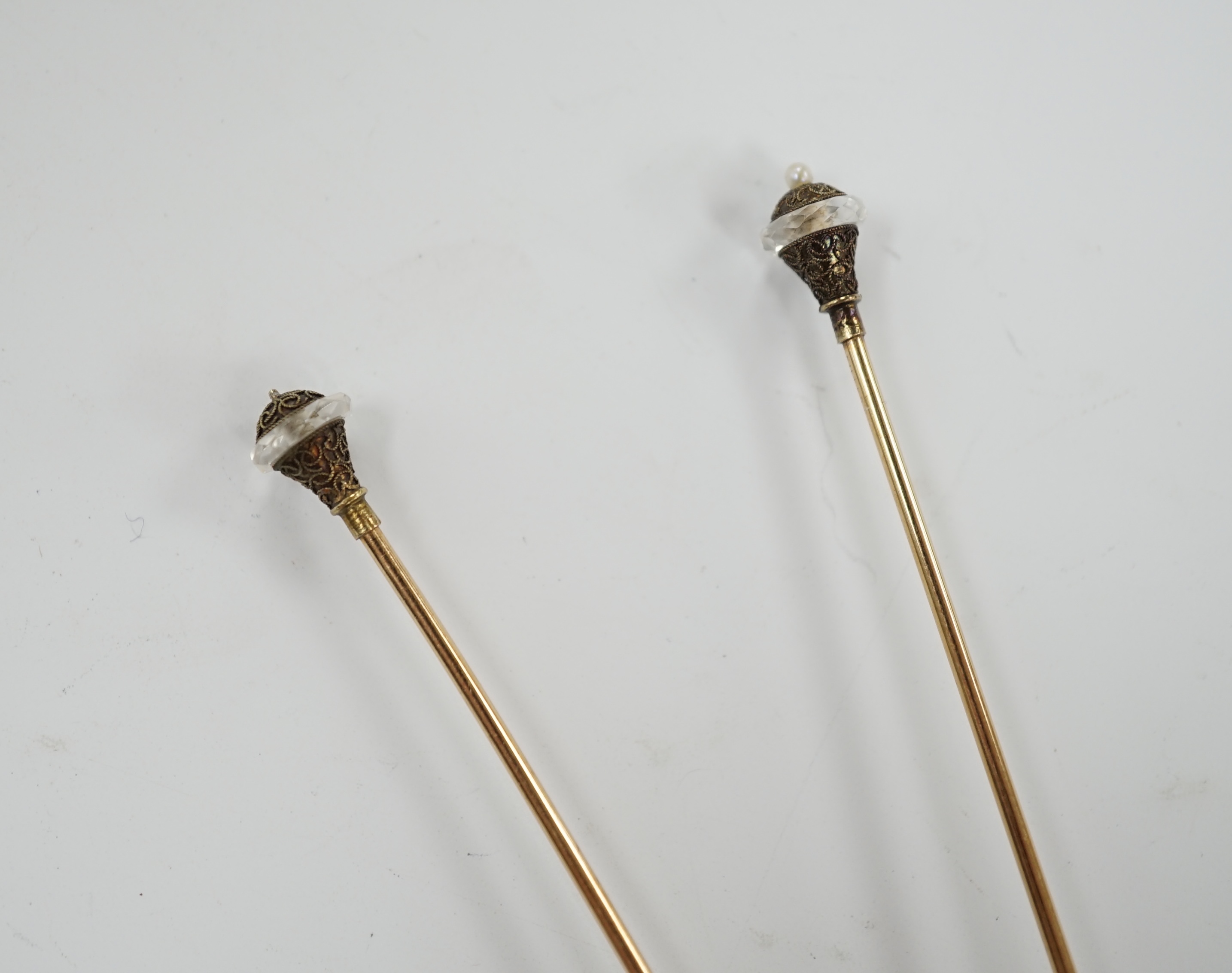 A pair of seed pearl set 'filled pin' hatpins, one a.f. 16cm.